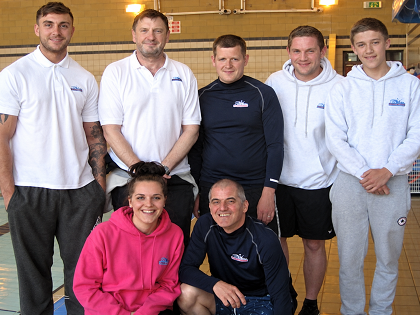 The experienced Swim Leeds instructor team together beside the pool